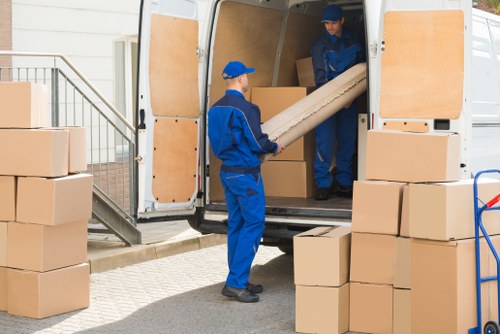 Helper carrying furniture during a Brunswickpark relocation