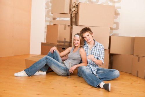 Mover lifting a box safely during a van relocation