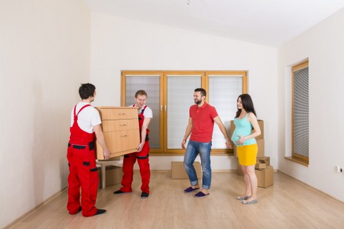 Professional moving van service handling boxes and household items